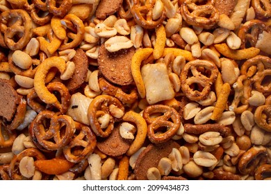 a natural healthy trail mix snacks food display nuts peanuts pretzels corn sticks rye chips rice crackers snack background