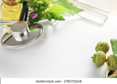 Natural Herbal Medicine Concept. Clipboard With Stethoscope, Plants, Leaves Of Healing Herbs And Healthy Oils With Copy Space. Alternative Medicine