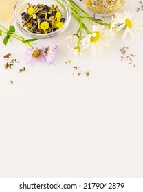 Natural, Homemade, Herbal Tea From Wild Plants And Flowers. Home Herbal Apothecary Concept. Eco Friendly Composition With Natural Flowers And Herbs, Tea Bags On A White Background With Copy Space