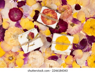 Natural homemade soap wrapped in handmade pressed flower paper lies on rose petals. Corporate or personal gift idea. Gift for Women's Day, Valentine's Day, Mother's Day. - Shutterstock ID 2246184343