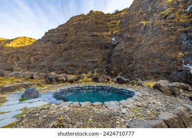 natural hot springs in the mountains; Husafell Canyon Baths, Iceland - Powered by Shutterstock