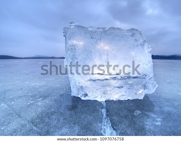Natural ice blocks.\
Ice floe breaking due to strong wind against the shore and move.\
Freezing winter\
weather.