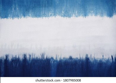 A natural indigo dye on cotton fabric showing color flow and its pattern.  Horizontal blue and white. At center is good for texts, copy space and advertisement. Material, object, background, design.   - Shutterstock ID 1807985008