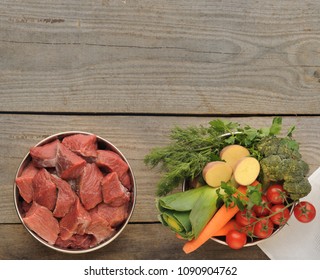 Natural Ingredients For Dog Food In Four Bowls On Old Wooden Background