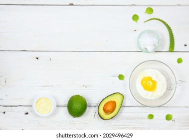 Natural Ingredients For Smoothing, Softening And Hydrating Your Hair.  Avocado, Aloe Vera,  Yogurt, Coconut Oil, Shea Butter And  Egg Yolk For Hair Mask, Flat Lay, Copy Space.