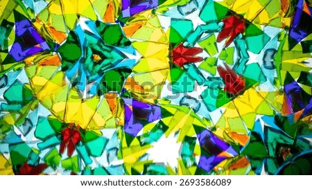 Natural kaleidoscope pattern captured with a camera, featuring vibrant stained glass colors and geometric symmetry.