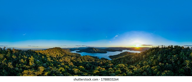 Natural Lake Aerial Panorama With Mountain Landscape And Forest Background Reflection Of Clouds On Rippling Water. Scenic Relaxing Scenery On A Clear Summer Day 4K HD High Definition 