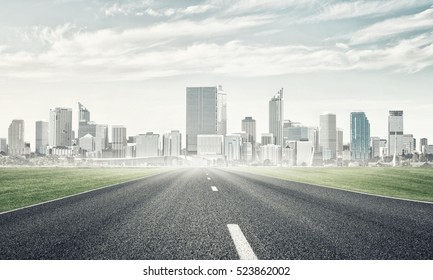 Natural Landscape With Asphalt Road And Modern City