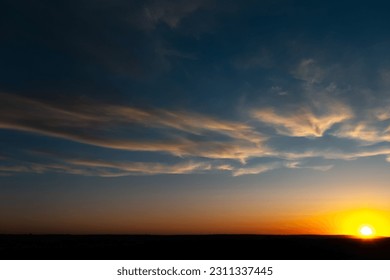Natural landscape of beautiful colourful sunrise with yellow clouds. - Shutterstock ID 2311337445