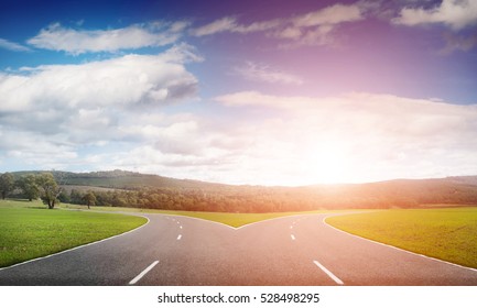 Natural landscape image of forked asphalt road