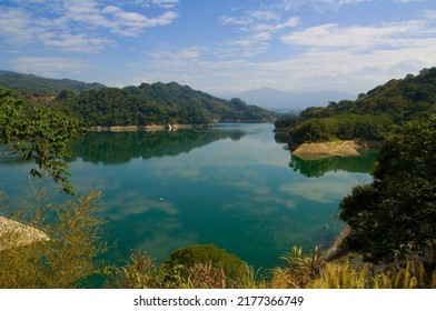Natural landscape of reservoir lake and mountain forest