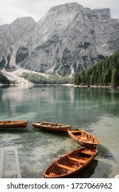 Natural landscapes of the mountain lake Braies in the Dolomites, Italy. Boats on the mountain lake Braies (Lake Pragser Wildsee) in Sudtirol. The mountains. Linked boats on a mountain lake