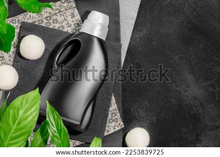 Similar – Image, Stock Photo Fabric softener | black and yellow laundry wafting fragrant in alleyway