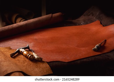 Natural Leather Brown Color Dark Background With Tools Of Shoes Maker, Copy Space.