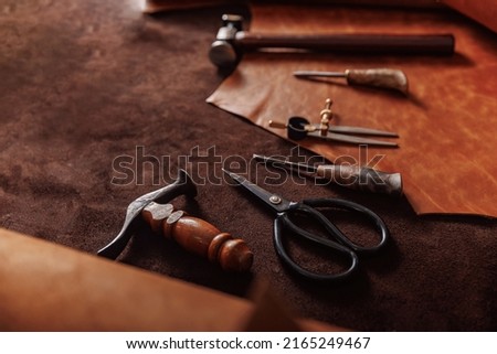 Natural leather brown color with tools, copy space. Concept banner background tailor shoes maker