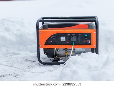 natural light. shallow depth of field. snow. an autonomous generator for generating electricity. close-up.
