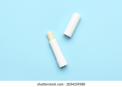 Natural lip balms on color background - Shutterstock ID 2034259580