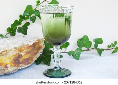 Natural Liquid Chlorophyll. Chlorophyll Drops In A Glass Of Water