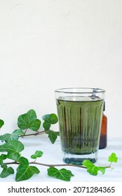 Natural Liquid Chlorophyll. Chlorophyll Drops In A Glass Of Water