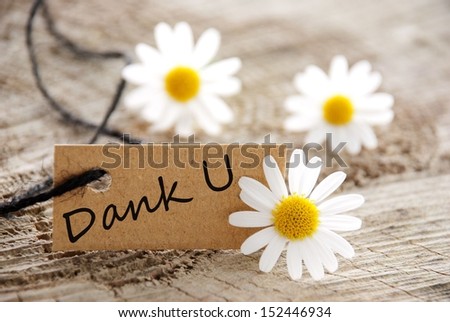 A Natural Looking Label with the Dutch Word Dank U Which Means Thanks