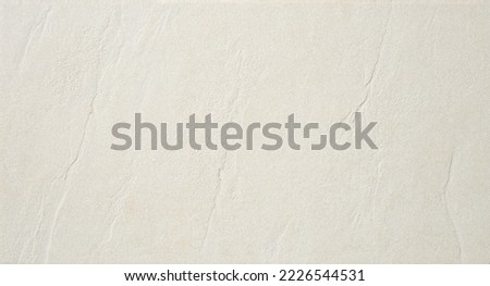 A natural marble texture in cream colour for luxury tile wallpaper. Creative Stone Stone wall art interiors background design. real image. lightly textured soft background.