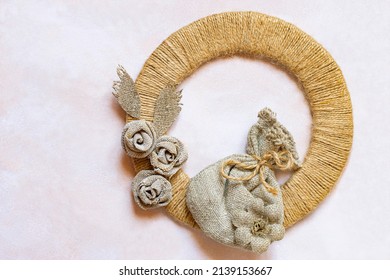 Natural materials jute thread and burlap in eco-decor. Jute ring embellished with handmade burlap flowers and burlap pouch. Eco-friendly natural materials for handicraft