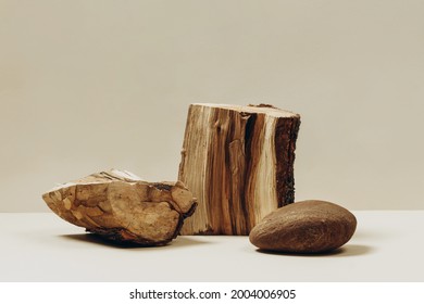 Natural materials stone and wood on a beige background, a natural background for your product. Fashionable design podiums from natural materials