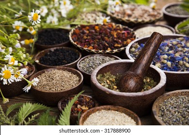 Natural medicine, wooden table background - Shutterstock ID 317888900
