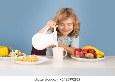 Natural milk. Child drink dairy milk. Healthy child pours milk from jug. - Powered by Shutterstock