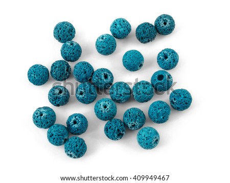 Natural mineral gemstone blue lave volcanic rock beads isolated on white background