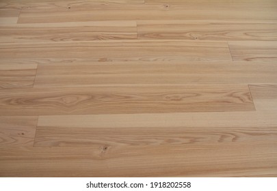 Natural oak wood laminate flooring background. Wood parquet flooring texture. 