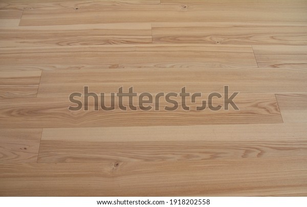 Natural oak wood laminate flooring background.\
Wood parquet flooring texture.\
