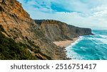 Natural oceanscape with ocean rocky shore - Drone top view. Beautiful landscape of Atlantic ocean coastline, Portugal. Aerial view of Scenic tourist travel destination. No people. Summer. Blue sky