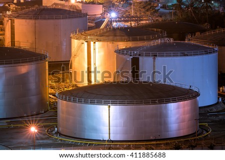 Natural Oil and Gas storage tanks and in Petrochemical industrial plant at night 
