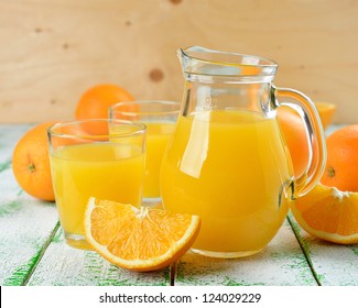 Natural Orange Juice In A Jug On A White Table