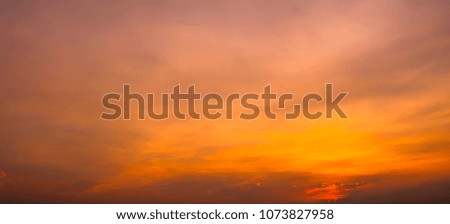 Natural orange sky with cloud closeup or background.Beautiful sunset with dark clouds.