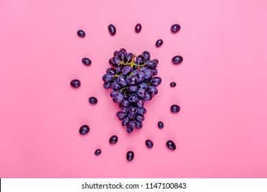 Natural organic black juicy grapes on a trend pink millennial background  Top View Flat Lay. Rustic Style Country Village Agriculture concepts 