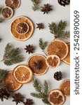 Natural organic composition with dried oranges, cones, star anise and fir twigs. Holidays concept, natural background.