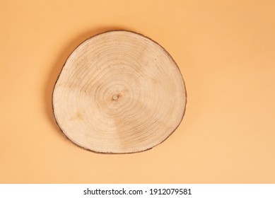 Natural organic eco-friendly beauty product concept. Wooden cross section cut on beige background. Showcase for cosmetic products. Top view, mockup. Product advertisement. wood slice - Shutterstock ID 1912079581