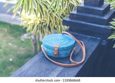 Natural organic handmade rattan handbag closeup. Blue color.