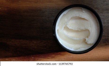 Natural Organic Shea Butter On A Wooden Background
