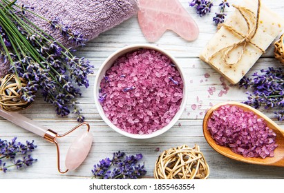 Natural organic SPA cosmetic with lavender. Flat lay bath salt, spa products and lavender flowers on wooden background. Skin care, beauty treatment concept - Powered by Shutterstock