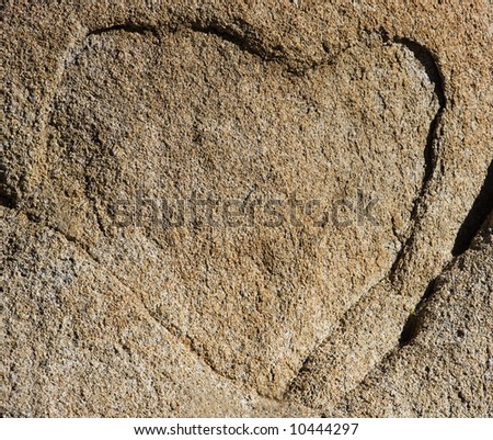 A natural outline of a heart on a rock face.