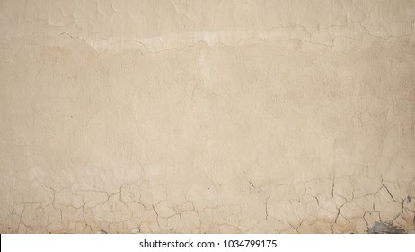 Natural pale yellow clay texture background wall with cracks      