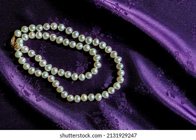 Natural Pearl Necklace On Royal Purple Satin