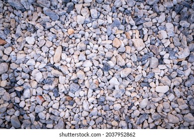 Natural Pebbles Stone Texture Background And Wallpaper. Pebbles Stone Decoration In Japanese Zen Garden. Small Stones As Part Of The Pathway. Beautiful Abstract White, Grey, And Blue Tone Background.