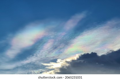 Natural Phenomenon Of Rainbow Cloud Or Iridescent Cloud In Blue Sky