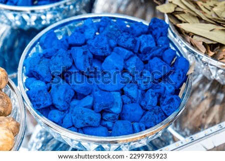 Natural pieces of indigo sold in a middle-eastern souk market stall in Dubai.
