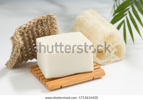 Natural Plant Based Solid Soap\
Bar on wooden Soap Dish with Knit Twine Scrubber and Luffa\
Sponge