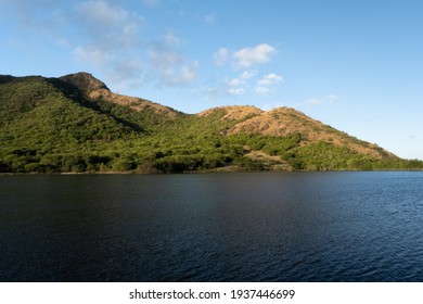 A natural pond or water catchment in the Caribbean